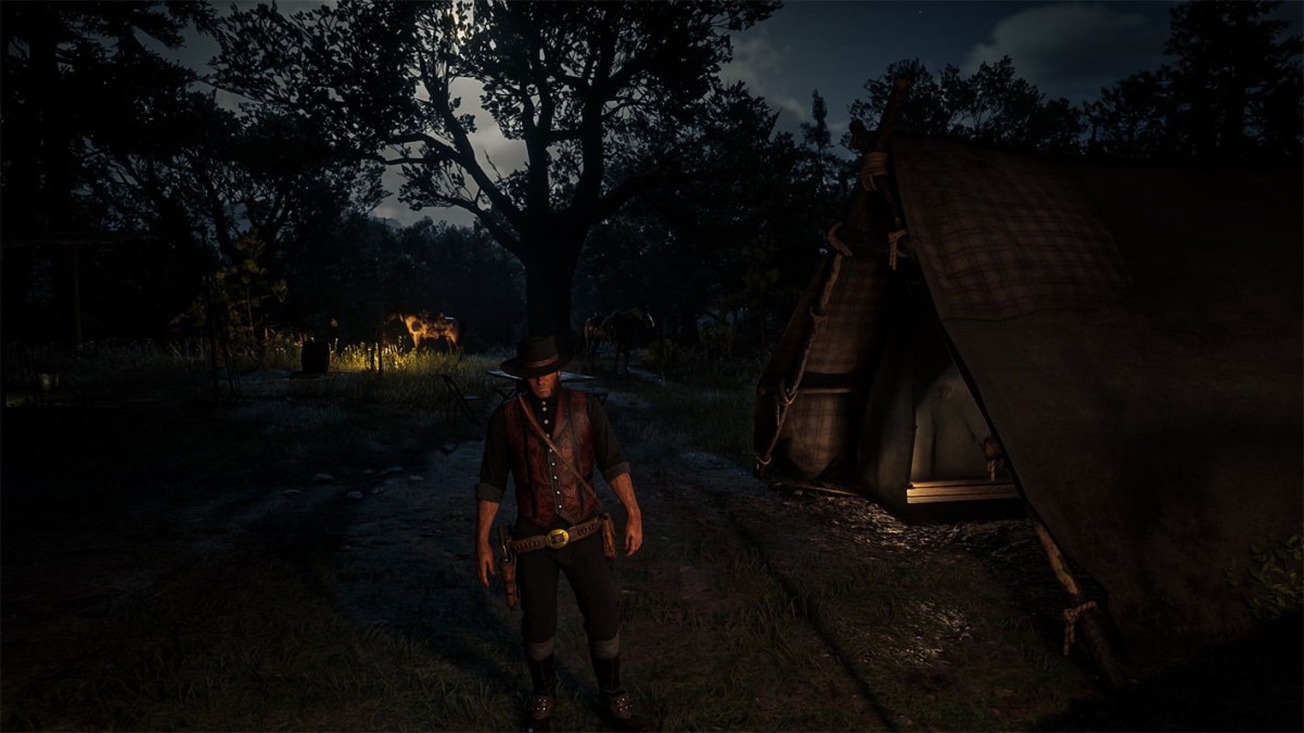 Arthur Morgan standing at camp at night in Red Dead Redemption 2, cinematic story atmosphere