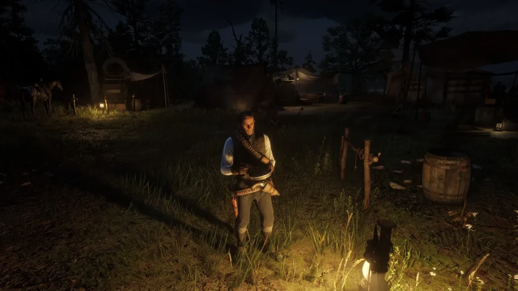 Arthur Morgan standing alone in camp at night in Red Dead Redemption 2